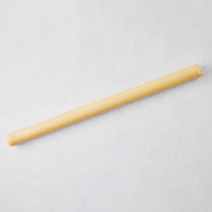 Oversized 22-inch amber taper candle made of paraffin and tree resin with a gold HG logo on a light gray background.