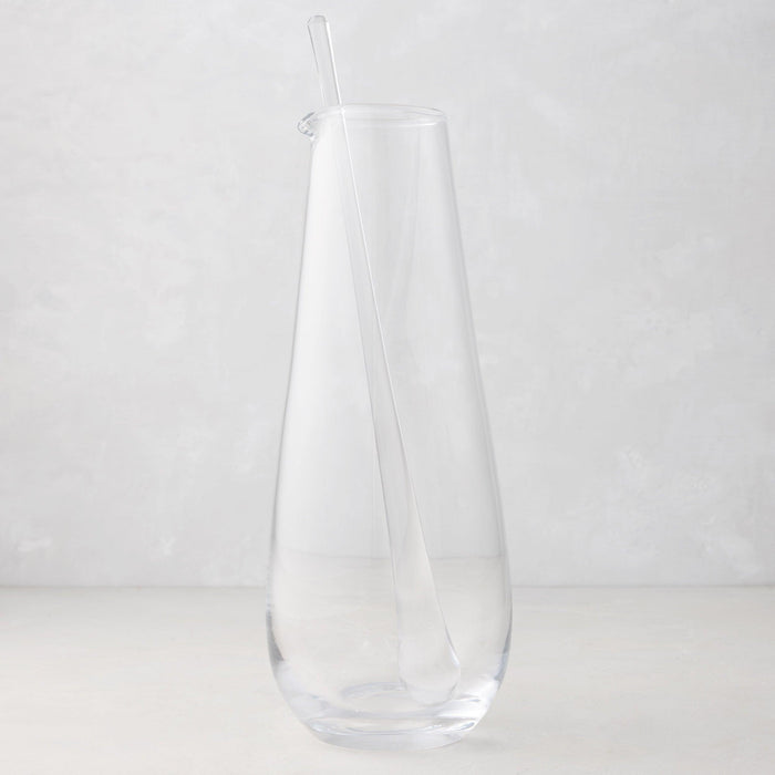Clear, mouth-blown glass bar cocktail jug with a heavy base and a long glass stirrer, 11.5" tall.