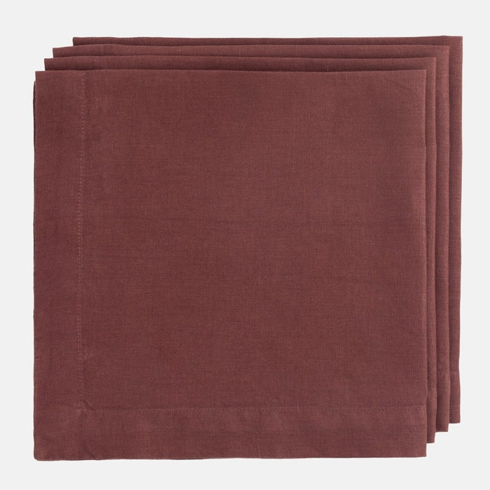 Barnwood HG Signature Hand-dyed Linen Napkin, folded, in a soft, warm maroon color.