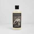 Peterman's 8oz Beeswax Conditioner for Wood Boards & Bowls, light bottle with black label featuring a man.