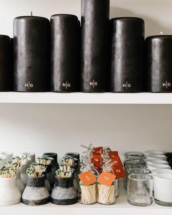 HG Black Unscented Pillar Candle, 5"x6", with gold HG logo.