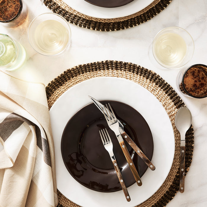 Buffalo Bistro 5-piece flatware set with stainless steel heads and brown acrylic handles arranged on a place setting.