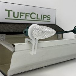 Certified Lights Original Tuff Clip holiday light gutter clip made of durable white plastic. Features a 360-degree rotating fastener.