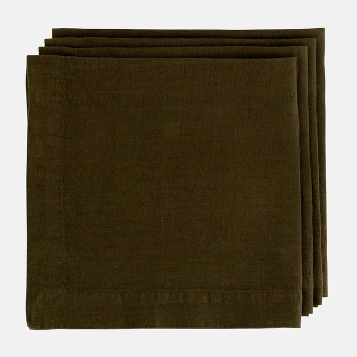 Stack of three Cedar HG Signature hand-dyed dark mossy green linen napkins, 22-inch square.