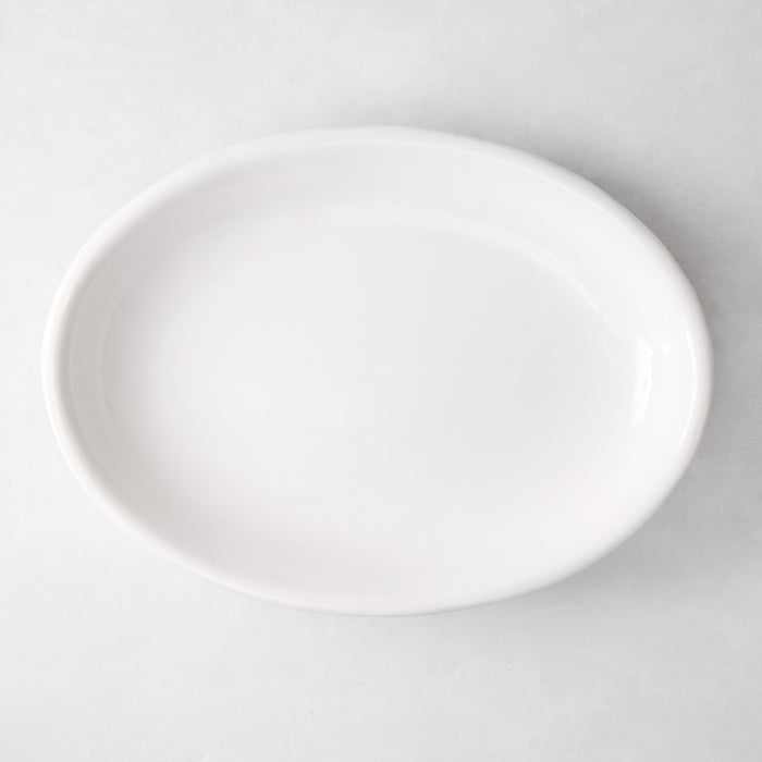 White ceramic deep serving platter, 14"W x 20"L, with high rolled edge.