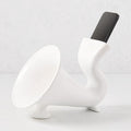 White ceramic kitchen speaker with a smartphone docked in the top opening.