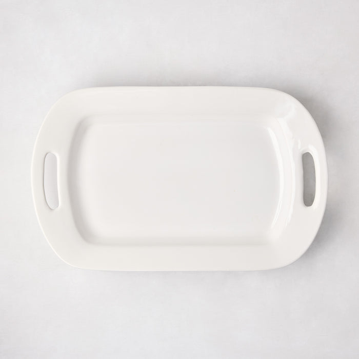 White ceramic serving platter with handles, 11"W x 18"L, from HG Ceramic Medium collection.
