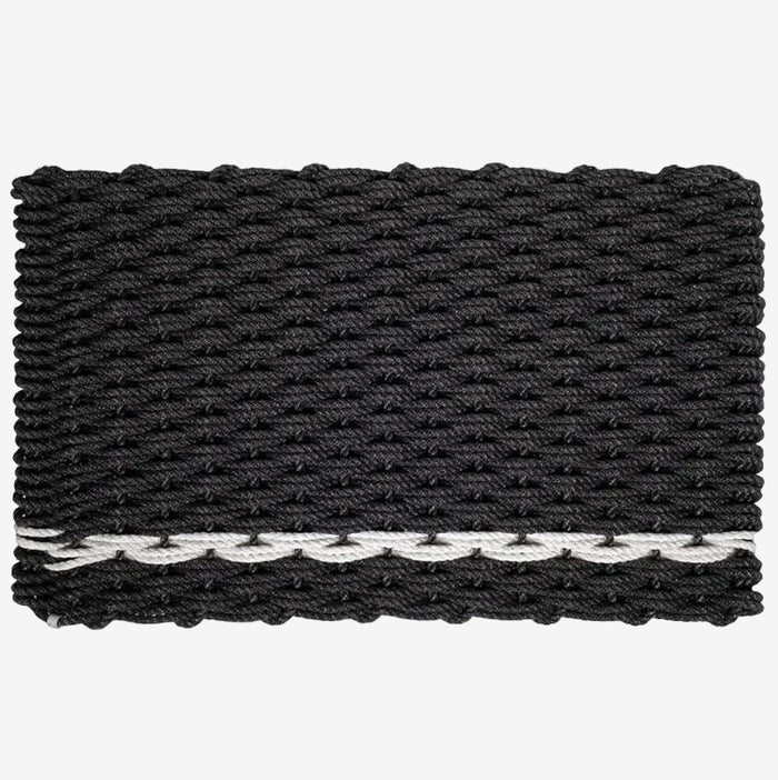 Handwoven charcoal rope doormat with a white pearl stripe along the bottom edge.