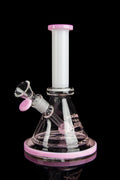 Pink and clear glass water pipe (bong) with a glass bowl, isolated on a black background."