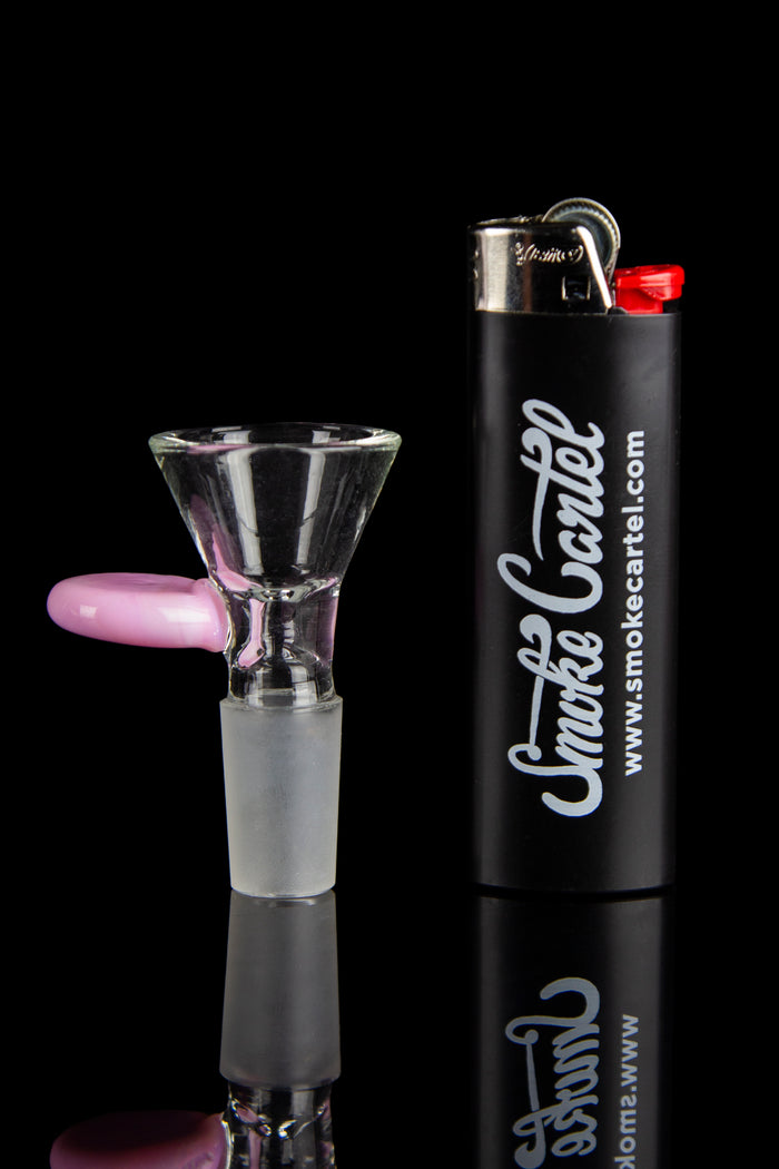 Glass cannabis bowl and lighter with "Smoke Cartel" branding against a black background.