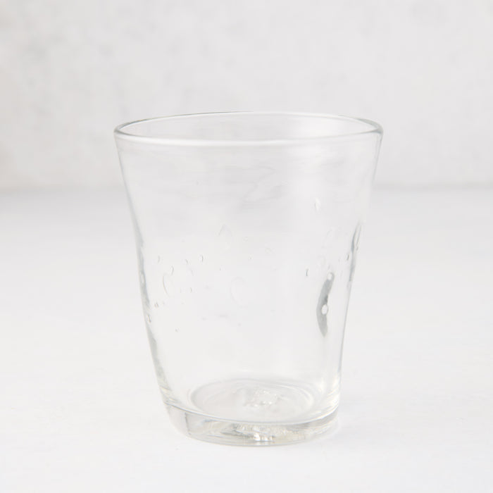 Clear Henri mouth-blown glass, 8 oz, with unique imperfections and small air bubbles.