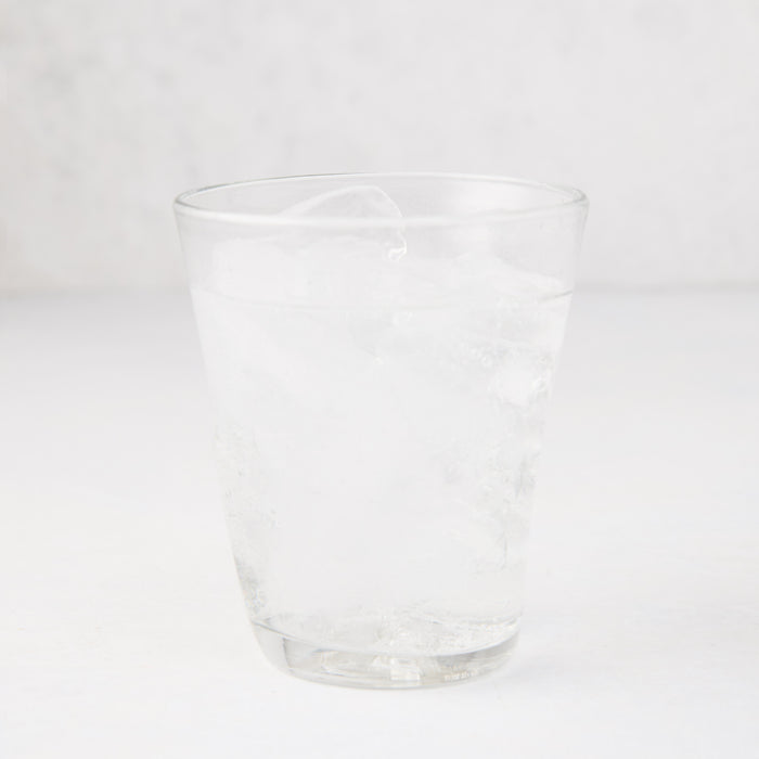 Clear Henri 8 oz. mouth-blown glass with ice and water, handmade.