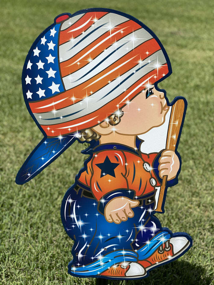 cute kids yard art sign of a little boy with a backwards baseball cap on holding a baseball bat. Patriotic ccolors and theme. Yard signs with stakes pefect for spring and summer lawn decorating.