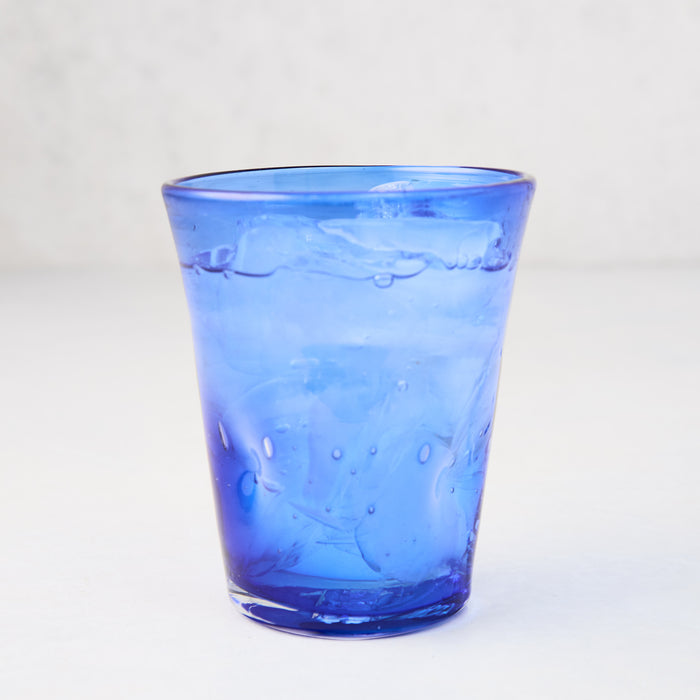 Dark blue Henri mouth-blown glass, 8 oz., with unique imperfections and small air bubbles.