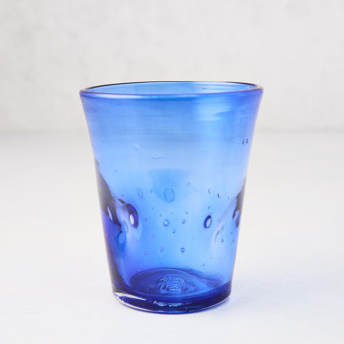 Dark blue Henri 8 oz. mouth-blown glass with unique imperfections and small air bubbles.