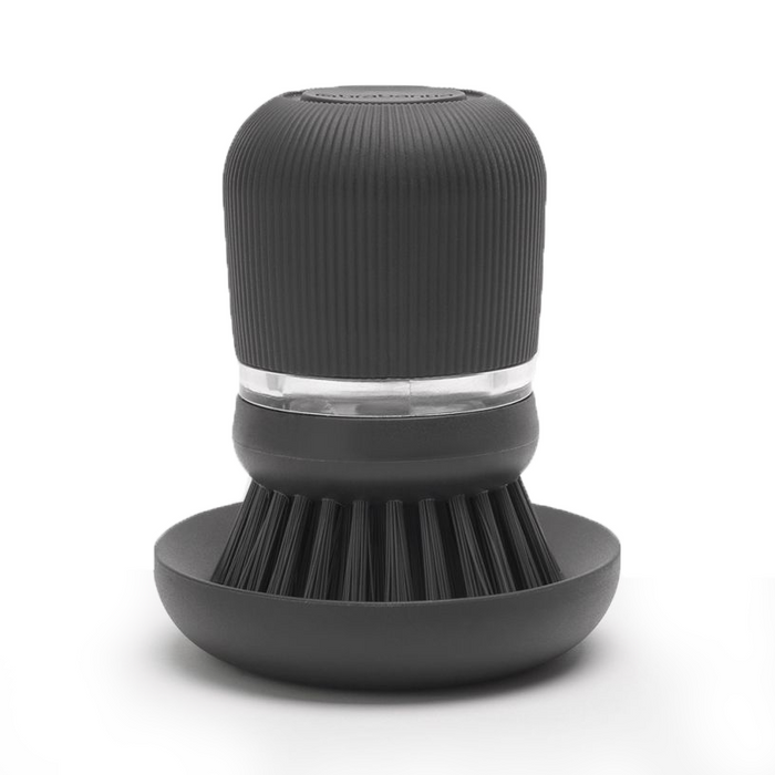 Dark grey soap dispensing dish brush with polyester bristles and a matching stand.