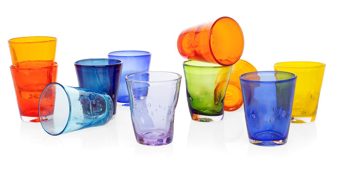 Assortment of colorful Henri mouth-blown glasses in various shades including orange, blue, green, and yellow.