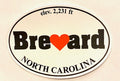 Oval white decal with the text 'I Love Brevard, North Carolina - Elevation 2,231 ft' with the name Brevard written in bold and a red heart replacing the 'v'.