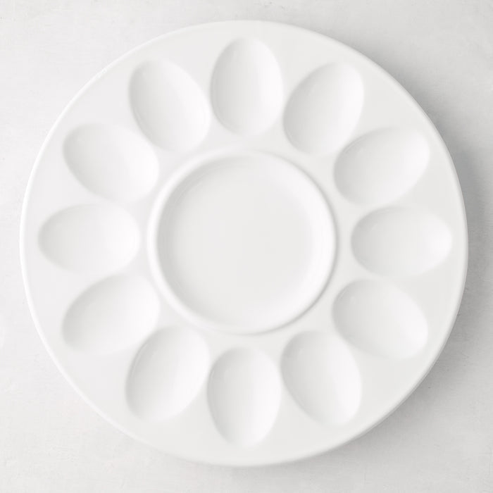 White ceramic Deviled Egg Serving Platter, 11"Dia, with 12 egg indentations and a center dip well.