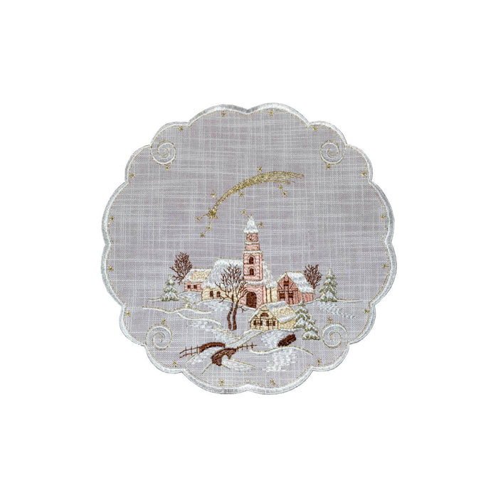 Round white linen doily with scalloped edges and embroidered snowy village scene featuring a church and shooting star