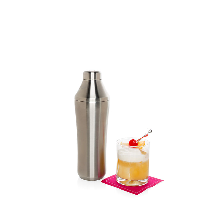 Hudson Grace Double Old-Fashioned Glass with cocktail and stainless steel shaker on a pink napkin.