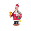 This detailed, hand-carved German Santa is the perfect addition to your holiday décor. The wooden figure is hand-painted and has a burlap sack full of presents over one shoulder and a Wunschzettel, or wish list, in one hand and a bell in the other. He's even smoking pipe for a truly authentic look.
