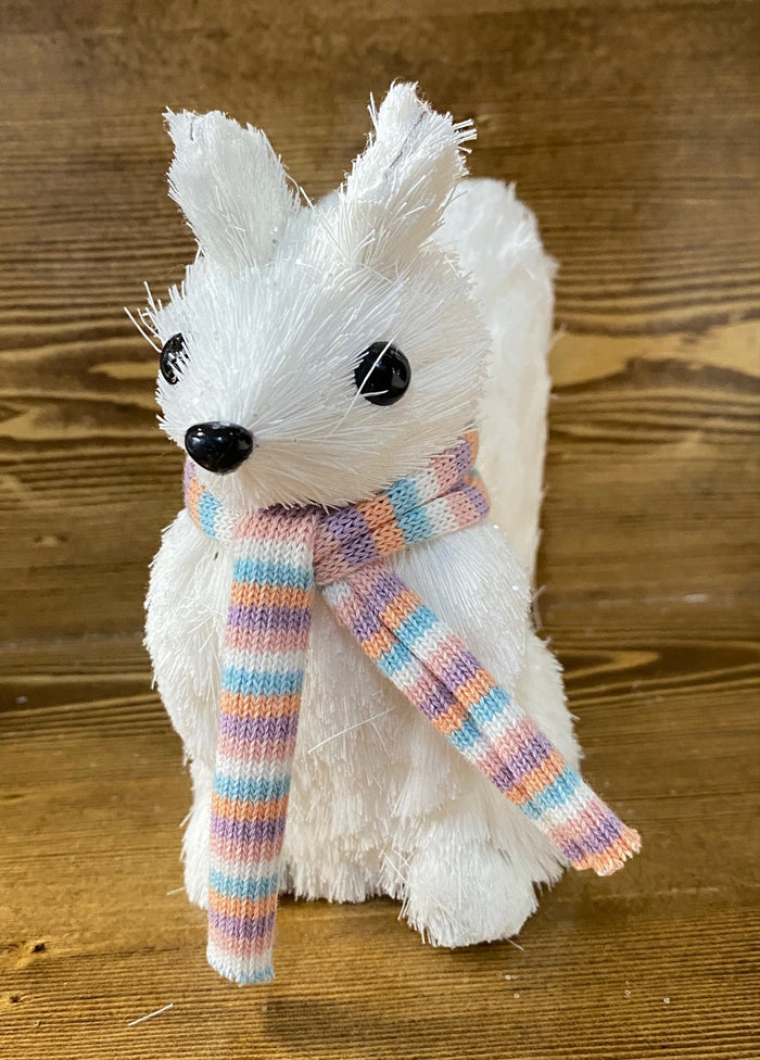 Front view of our sisal white squirrel figurine wearing a pastel striped scarf.
