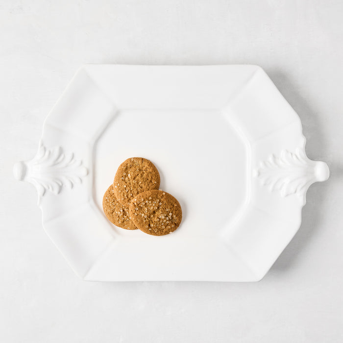 White octagon ceramic serving platter with Fleur de Lys detailing, 10.75"W x 15"L.