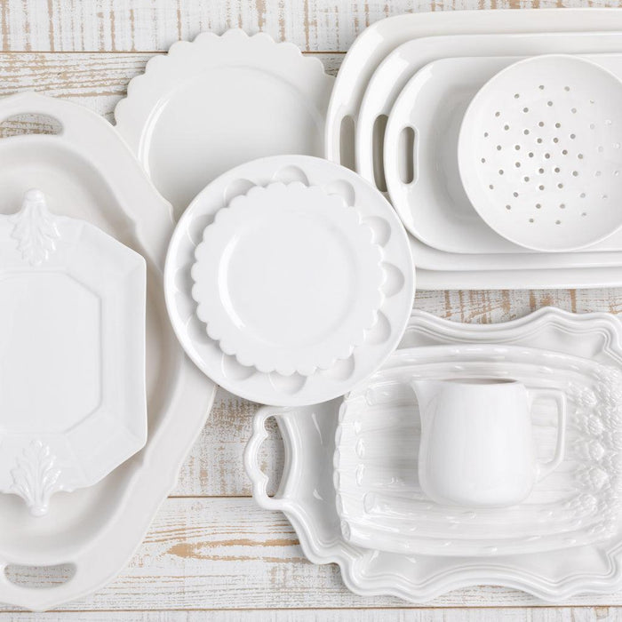 White ceramic Fleur de Lys octagon serving platter with classic French detailing, 10.75"W x 15"L.