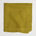 Goldenrod HG Signature hand-dyed linen napkin, 22-inch square, folded, with mitered corners.