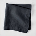 Graphite HG Signature hand-dyed 22-inch square linen napkin, folded.