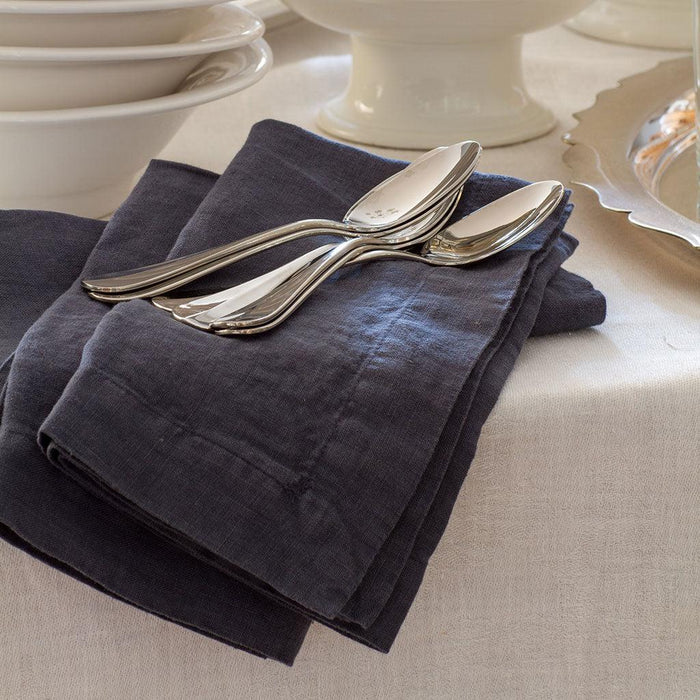 Graphite HG Signature hand-dyed linen napkin, 22" square, folded with two silver spoons.