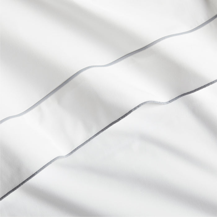 White percale sheet with a grey satin stitch border.