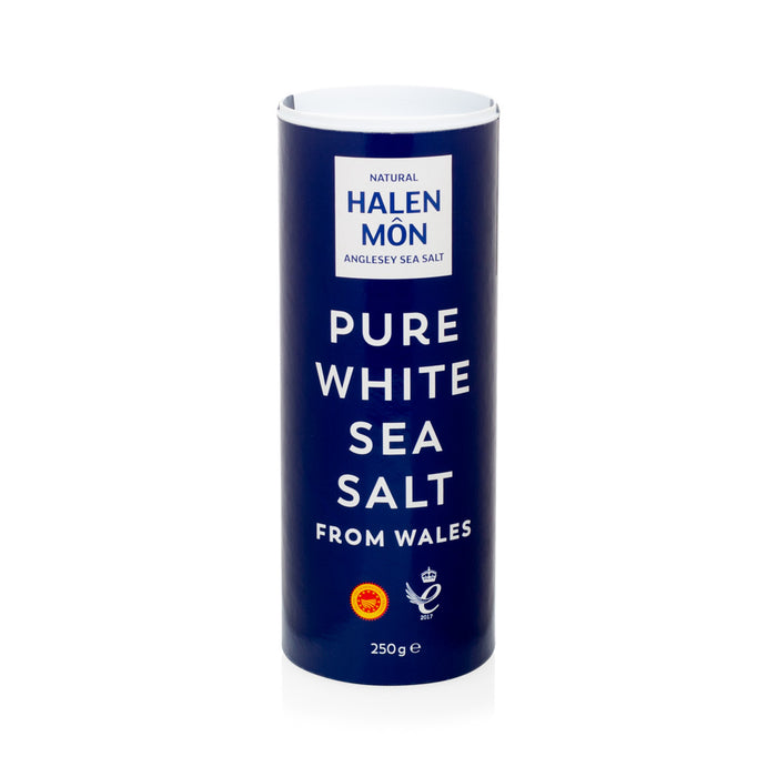 Halen Mon Pure White Sea Salt from Wales, 250g, in a tall navy blue cylindrical container.