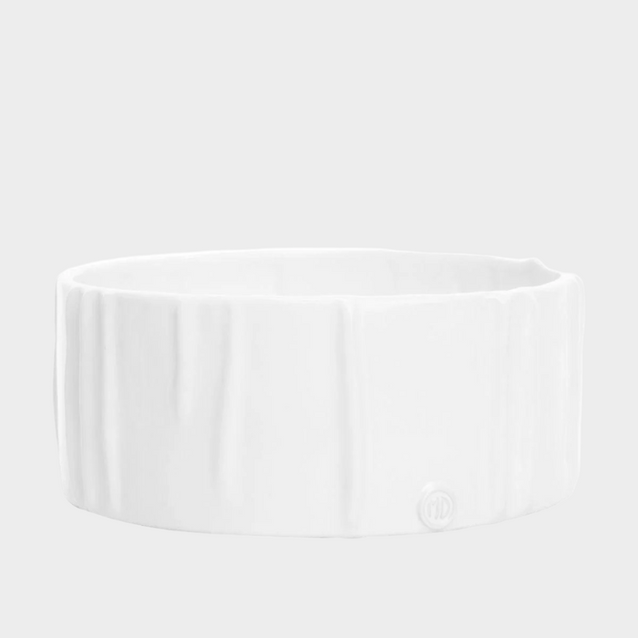 Handmade creamy white ceramic dog bowl by Montes Doggett, 8"Dia x 3"H, with textured sides.