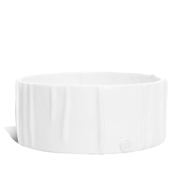 Handmade creamy white ceramic dog bowl by Montes Doggett, 8"Dia x 3"H, with textured sides.