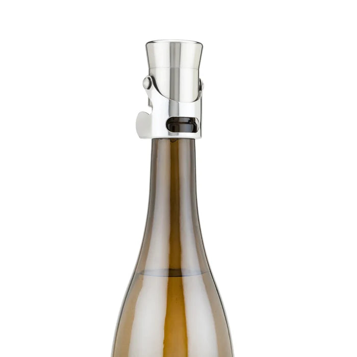 Heavyweight stainless steel champagne stopper on a brown bottle, featuring a sleek, brushed metal design.