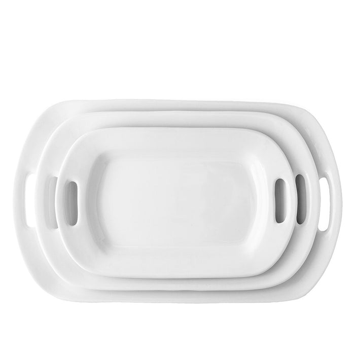 Set of 3 white ceramic serving platters with handles, nested from small to large.