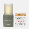 Hudson Grace Brentwood scented candle in frosted glass on a gray box, beside a white matchbox with "Pour Yourself a Drink" text.