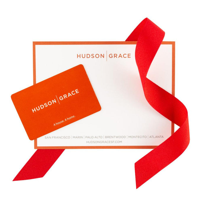 Hudson Grace orange gift card with white notecard and red ribbon.