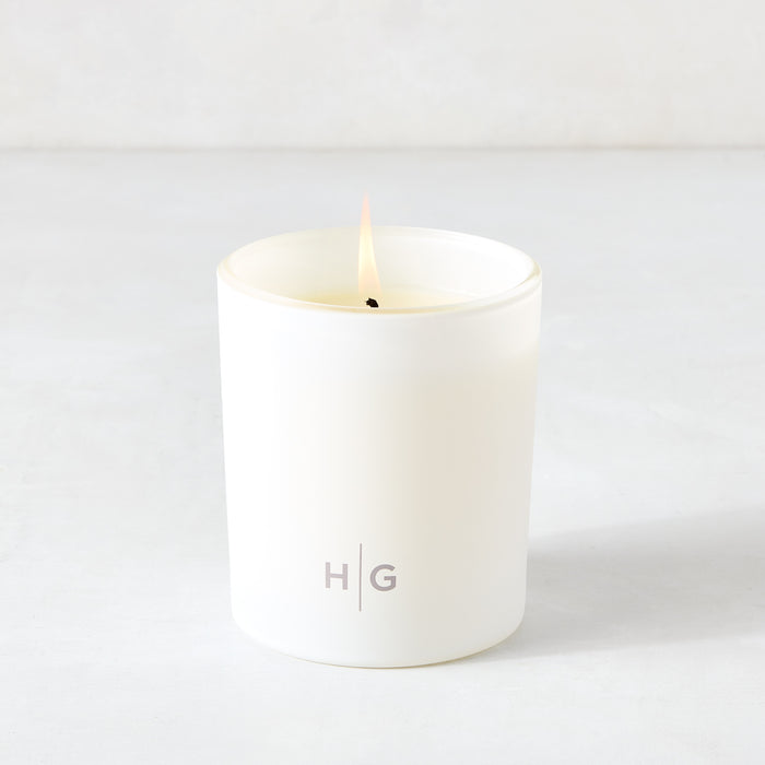 Hudson Grace Greenwich Scented Candle, single wick, in a white frosted glass vessel with "HG" logo.