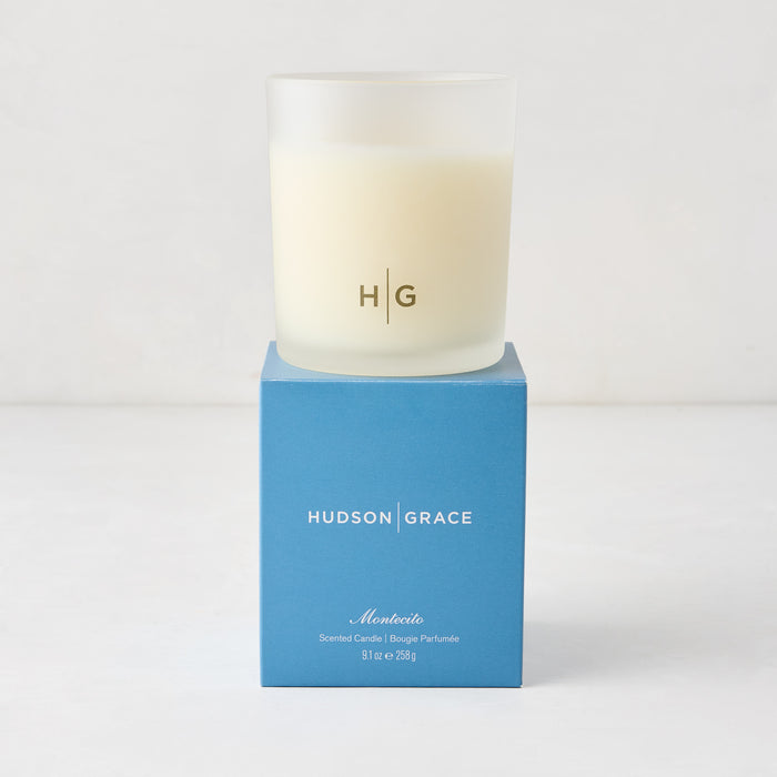 Hudson Grace Montecito scented candle in a frosted glass vessel with a blue gift box.