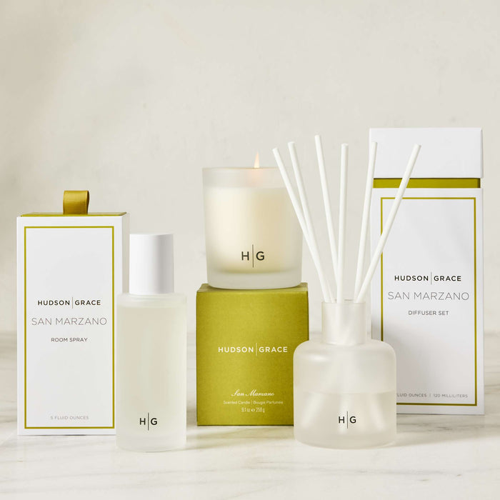 Hudson Grace San Marzano scented candle, room spray, and diffuser set in white and lime green packaging.