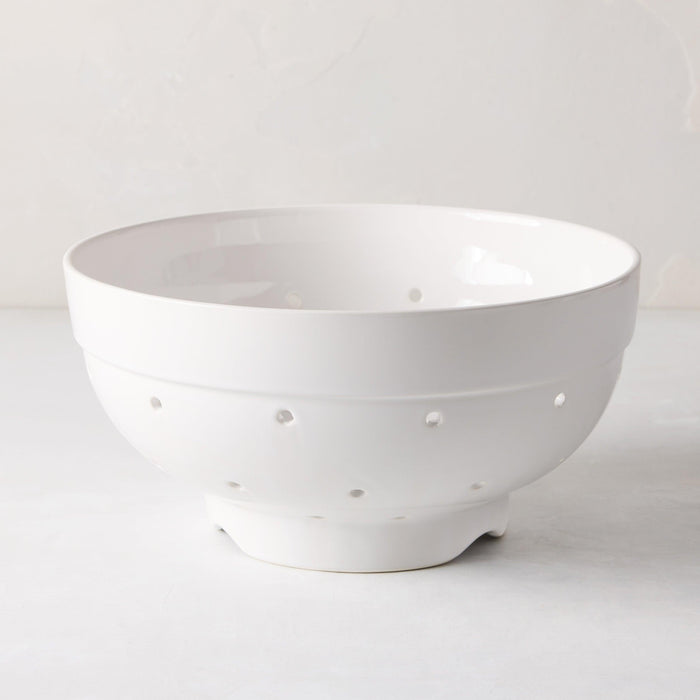 Hudson Grace white ceramic colander, 9.5"Dia x 5"H, with drainage holes and a footed base.