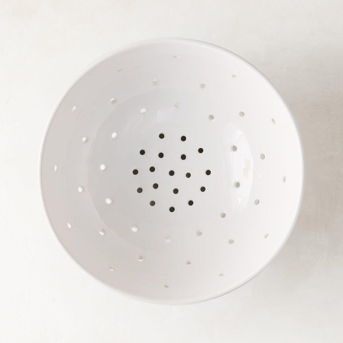 Hudson Grace white ceramic colander, 9.5"Dia, with small drainage holes.