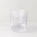 Clear, chunky Hudson Stemless Glass, 3.5"Dia x 4"H, with a thick base, on a white surface.