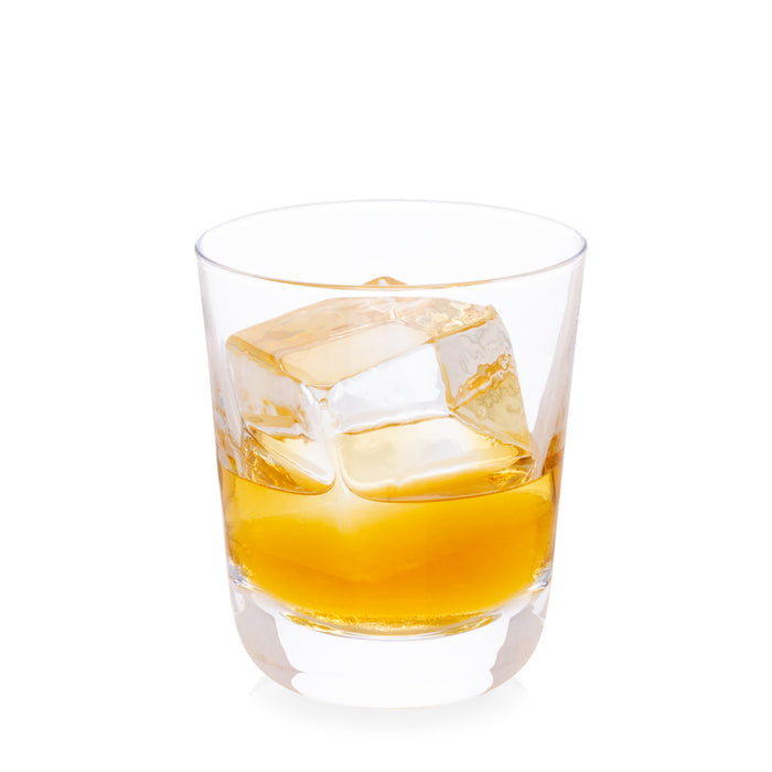 Hudson Stemless Glass with amber liquid and large ice cube, clear chunky glass.