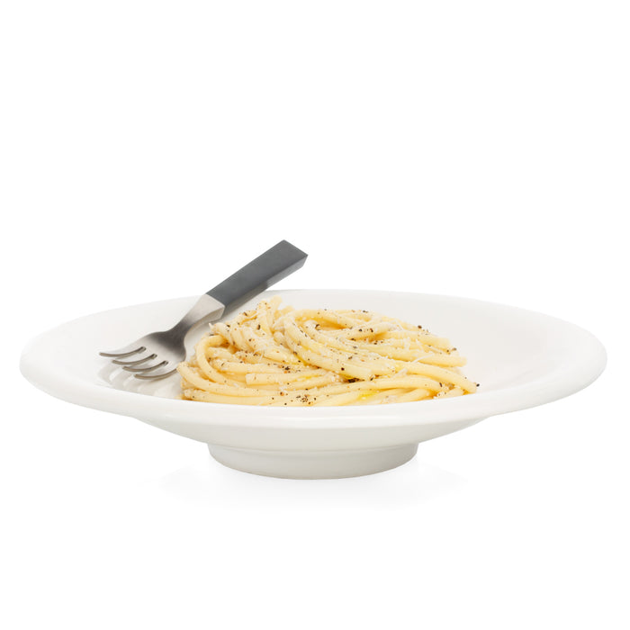White ceramic individual pasta bowl with spaghetti, pepper, and a fork.