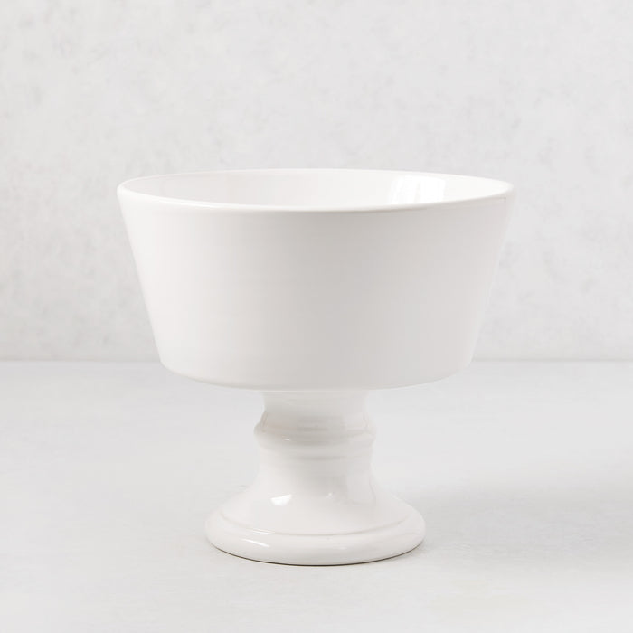 Italian white ceramic compote, 9" Dia x 8" H, with a modern footed bowl design and creamy glaze.