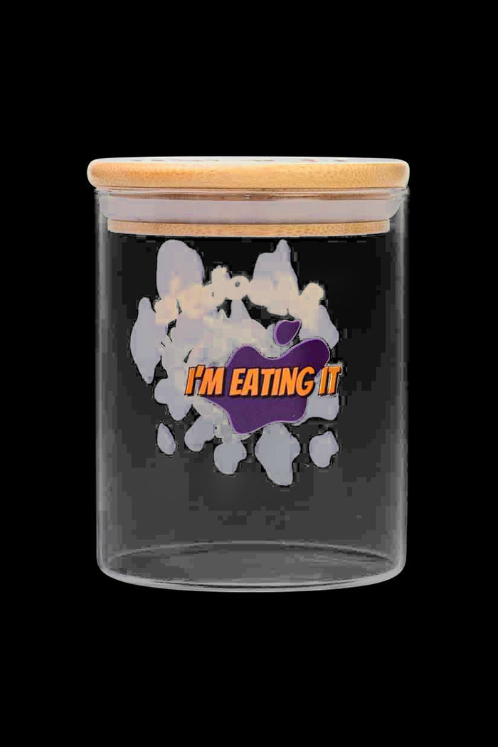 Front view of the “Jay and Silent Bob Moobys” Stash Jar, a clear glass jar with a wooden lid against a black backdrop.
